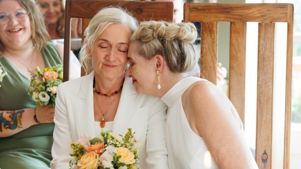Same-sex couple sharing a quiet, intimate moment during a wedding ceremony in Ireland