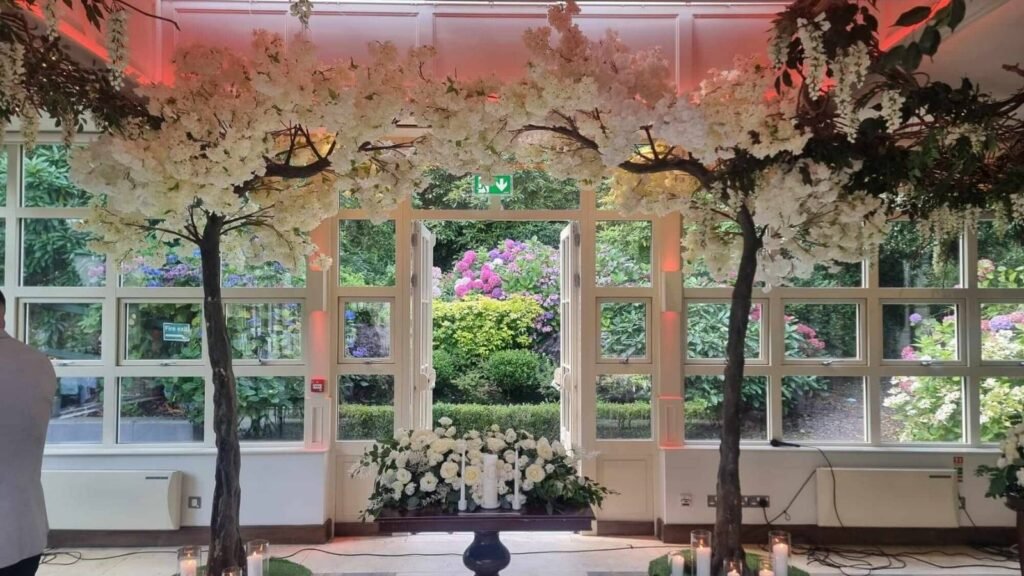 Indoor Irish wedding ceremony setup in a hotel venue, showing altar table, seating layout, décor and space considerations